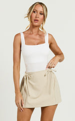 Camilla Mini Skirt - Mid Waist Pleated Back Bow Detail Skirt in Stone