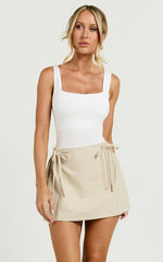 Camilla Mini Skirt - Mid Waist Pleated Back Bow Detail Skirt in Stone