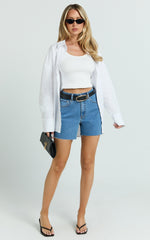 Jacqui Shorts - Mid Rise Frayed Hem Denim Shorts in Light Mid Blue