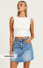 Adan Mini Skirt - Recycled Cotton Frayed Hem Denim Skirt in Mid Blue Wash