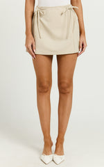 Camilla Mini Skirt - Mid Waist Pleated Back Bow Detail Skirt in Stone